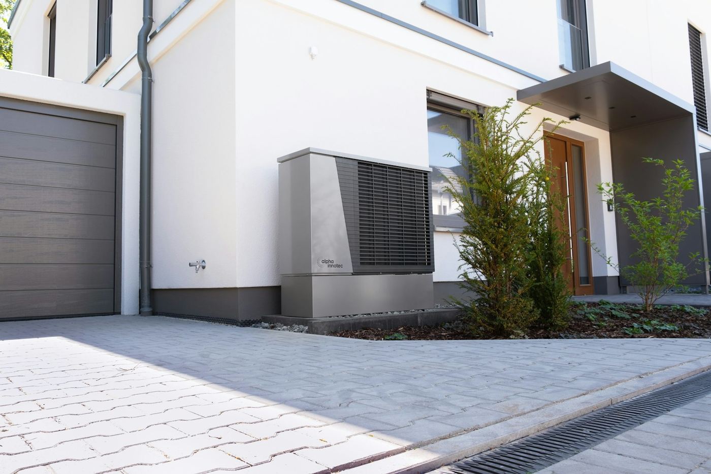 An air source heat pump unit outside a modern home